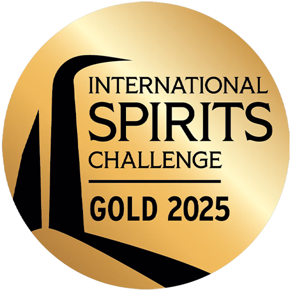 Circular gold medal with International Spirits Challenge Gold 2025 text and pouring liquid graphic element.