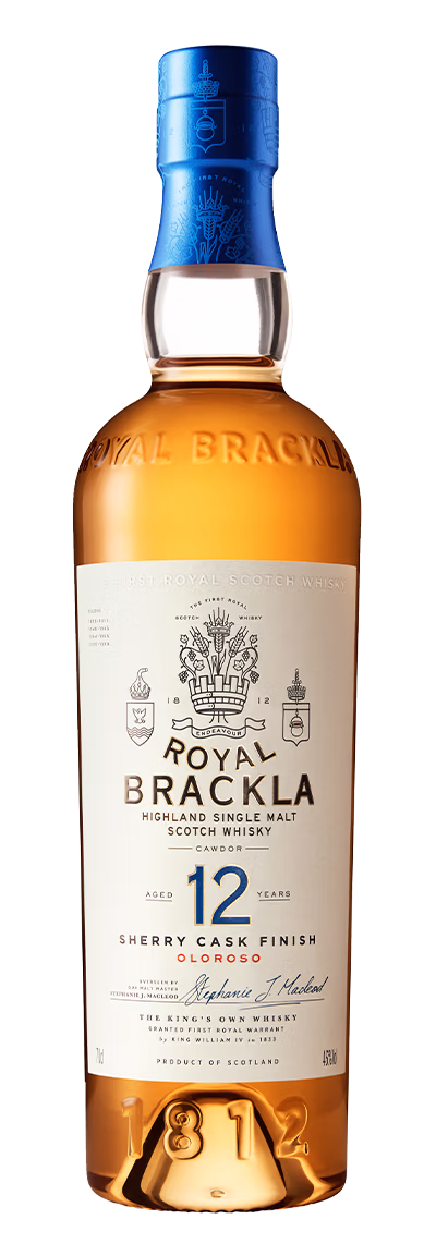Royal Brackla 12-year-old Highland Single Malt Scotch Whisky bottle with blue foil cap, cream label, and amber-gold liquid.